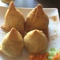 Vegetables Samosa (2 Pieces) · Deep fried pastry stuffed with spices potatoes and green peas. Serve with tamarind chutney.