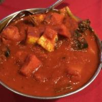 Veggie Vindaloo · Mixed seasonal vegetables and potatoes cooked with tomato and onion sauce in a Himalayan her...