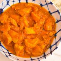 Chicken Vindaloo · Boneless chicken, potato, onion and tomato gravy cooked in himalayan herbs and spices, vineg...