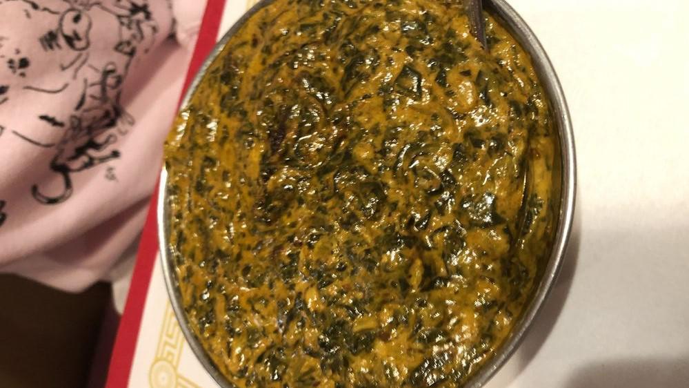 Shrimp Saag · Shrimps and spinach cooked in creamy tomato and onion sauce with Himalayan herbs and spices.