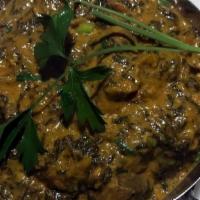 Lamb Saag · Boneless lamb and Spinach cooked with onion, tomato, and creamy sauce with Himalayan herbs a...