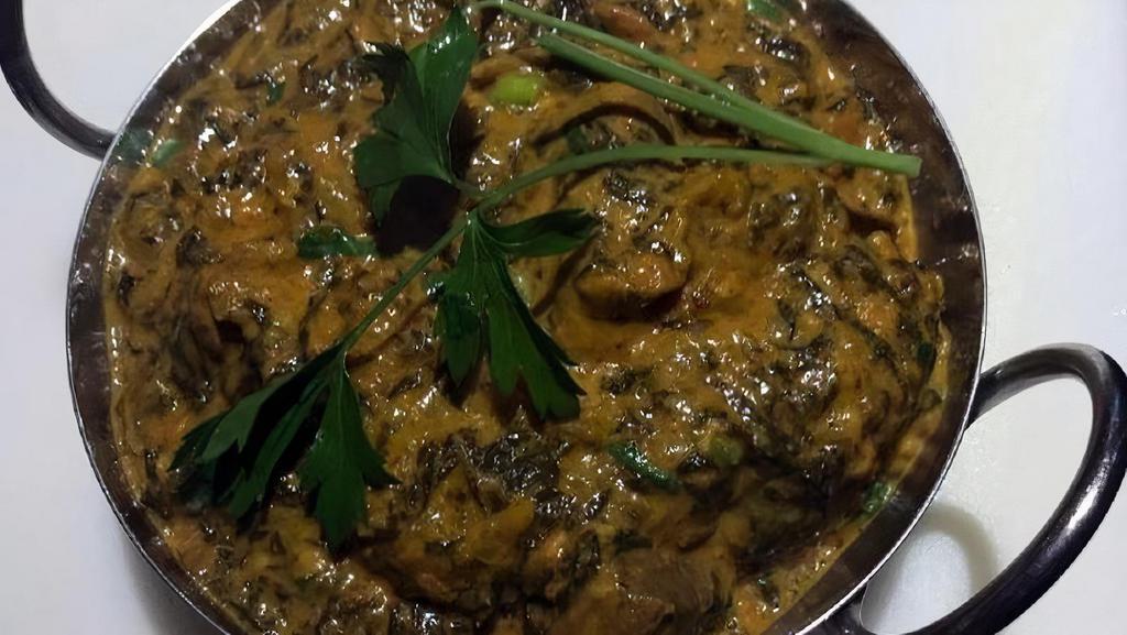 Lamb Saag · Boneless lamb and Spinach cooked with onion, tomato, and creamy sauce with Himalayan herbs and spices.