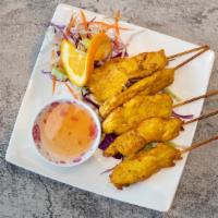 Satay Chicken (5 Pieces) · Chicken marinated in coconut milk served on skewers with homemade peanut sauce and cucumber,...