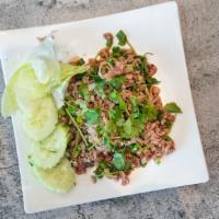 Beef Larb · Ground beef with book tripe (optional) mixed with green onion, cilantro, rice powder, ground...