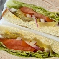 Turkey And Vegetables (Croissant) · Turkey, cheese, lettuce, tomato, red onion, pickles, mayo and mustard.