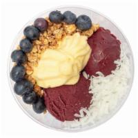 Tropicalicious Acai Bowl · Made with Sambazon Acai and Vegan Dole Pineapple Soft Serve topped with granola, blueberries...