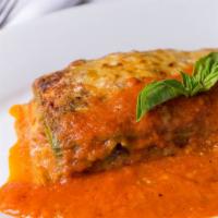 Lasagna · Home-style with soft, green spinach pasta, beef ragu, and Bechamel sauce.