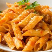Penne Salsiccia · Penne with chicken sausage, roasted pine nuts and sun-dried tomatoes in a red sauce.