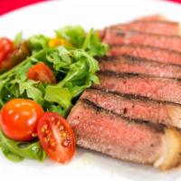 Tagliata Di Manzo Salad · Arugula salad and shaved Parmesan, topped with seared and sliced New York steak.