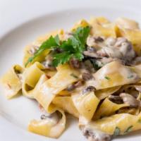 Pappardelle Tartufo · Wide flat egg noodles with wild mushrooms, prosciutto and white truffle oil.