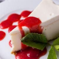 New York Cheesecake · With fresh strawberry sauce.
