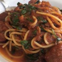 Meatball Spaghetti · Homemade meatballs, spinach, tomato sauce, basil and Parmesan.