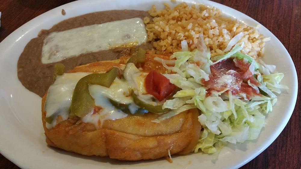 Chile Relleno · Ortega chile filled with melted cheese. includes a soup salad rice and beans.