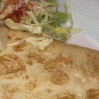 Quesadilla · Served with guacamole and sour cream.