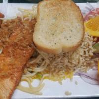 Filete De Salmon · Served on top of a pasta and spinach, rice, salad, garlic bread salmon fillet style.