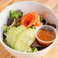 Garden Salad · mixed greens, cucumber, tomato & our house ginger dressing