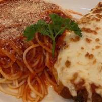 Chicken Parmigiana · Chicken breast lightly breaded and topped with mozzarella and marinara sauce. Served with yo...