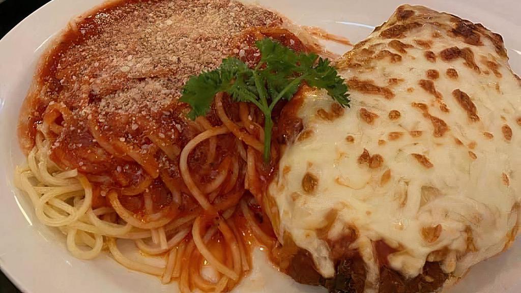 Chicken Parmigiana · Chicken breast lightly breaded and topped with mozzarella and marinara sauce. Served with your choice of pasta.