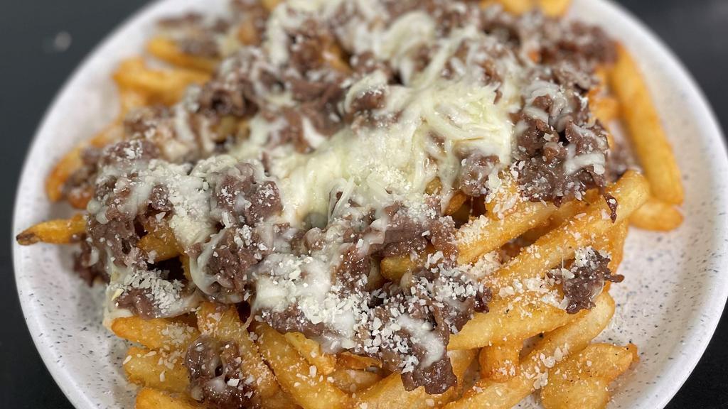 Bulgogi Fries · Crispy fries with marinated thinly sliced rib eye beef in Korean BBQ sauce, topped with pepper jack cheese.