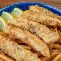Fish & Chips · Classic beer battered crispy fish fillet served with Cajun chips and lemon mayo dipping sauce.