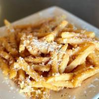 Garlic Fries · Fries tossed with minced garlic , butter and topped with Parmesan cheese.