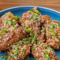 Garlic & Pepper Wings · Tossed in minced garlic and spicy pepper.
