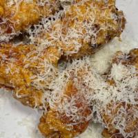 Honey & Garlic Wings · Glazed in honey and topped with parmesan cheese.