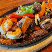 Steak & Shrimp · Stir fried sirloin beef with jumbo shrimp, mushrooms, broccoli , bell peppers and onions, co...