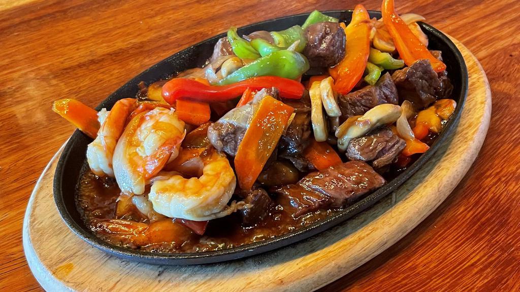 Steak & Shrimp · Stir fried sirloin beef with jumbo shrimp, mushrooms, broccoli , bell peppers and onions, comes with rice and pickled veggies