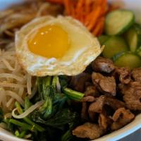 Beef Bibimbap · Cooked rice with sliced beef, assorted veggies, Korean spicy sauce with fried egg on top, co...