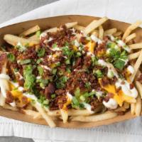 Baked Potato Fries · CLASSIC!. MELTED CHEESE SAUCE, BACON, GREEN ONIONS, SOUR CREAM