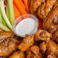 Wings 1/2 Doz · Cajun spiced wings fried for a delicious crisp. Served with celery, carrots, and ranch dippi...