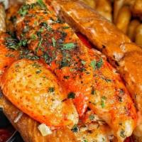 Lobster Roll · Lobster meat sautéed in garlic butter filled in between a brioche bun toasted with garlic bu...