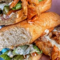 Softshell Po Boy · Soft Shell Crab in a toasted French roll with real Mustard and Remoulade spread. Crisp lettu...