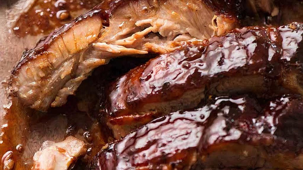 Bbq Ribs · Mouth-watering BBQ Ribs with your choice of 2 sides.