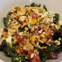 Chopped Kale Salad · Chopped kale topped with tomato, tri-colored beans, red bell peppers, garbanzo beans, carrot...