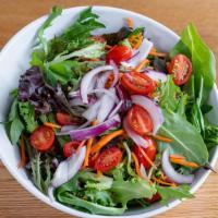 House Salad · Spring mix topped with heirloom cherry tomatoes, shredded carrots, fresh sliced red onion an...