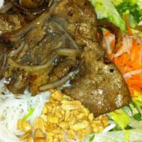 Bun Thit Bo Xao · Strips of marinated tenderloin beef and sauteed onions served over vermicelli rice noodles o...