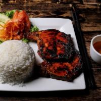 Suon Nuong · Marinated and grilled pork chop with rice.