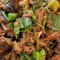 Grilled Beef Nam Tok With Sticky Rice · Spicy. Grilled beef, scallions, onions, cilantro, roasted rice powder mixed in chilli and li...