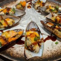 Baked Green Mussels · Six pieces. Green mussels with masago, scallions, eel sauce, samurai sauce.
