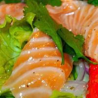 Salmon Sashimi Salad · Salmon, mixed greens, seaweed salad & sakana sauce.