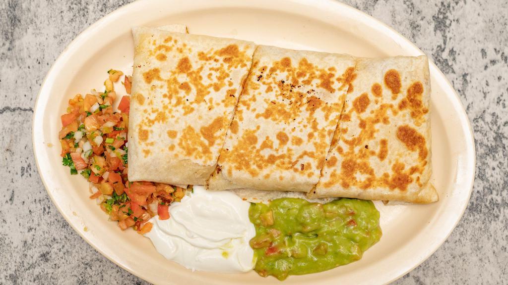 Giant Quesadilla · Delicious flour tortilla with melted cheese and meat inside companion with sour cream guacamole and pico de gallo on the side.
