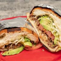 Torta · Your choice of meat plus, cheese, guacamole, sour cream, lettuce and tomatoes on a mexican r...