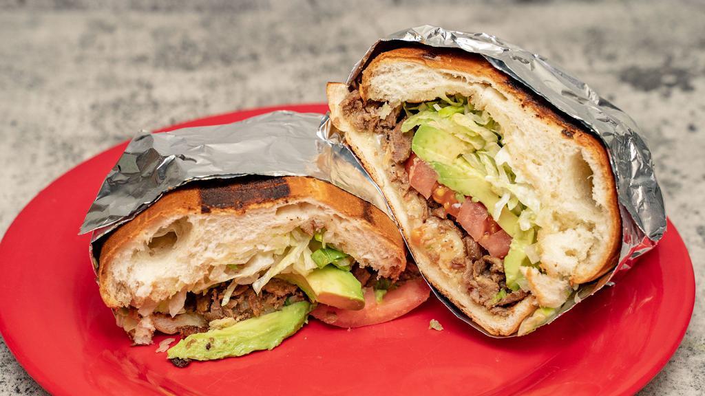 Torta · Your choice of meat plus, cheese, guacamole, sour cream, lettuce and tomatoes on a mexican roll.