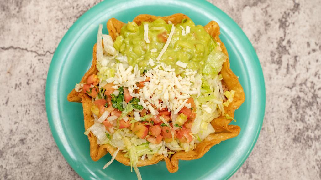 Taco Salad · Your choice of meat or vegetarian plus beans, rice, pico de gallo, cheese, guacamole, lettuce & sour cream.