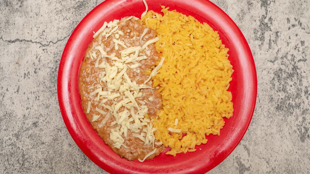 Rice And Beans · Half rice and Half  beans with cheese on the top
