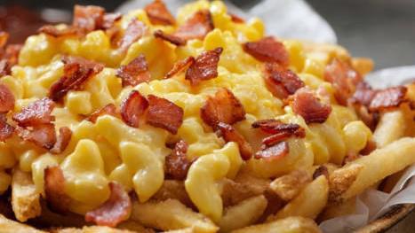 Bacon Cheese Fries · Traditional fresh cut french fries covered in melted cheese and crispy bacon.
