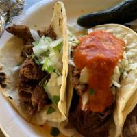 Tacos · Choice of meat, choice of tortilla, cilantro, onions.
