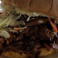 Bbq Pulled Pork Burger · Cheddar cheese, grilled onion, bacon, slaw, lettuce and bbq pulled pork.